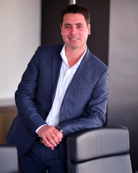 Man standing near a chair